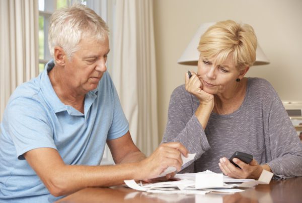 Worried Couple Checking Finances